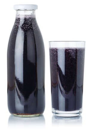Blueberry smoothie fruit juice drink blueberries in a bottle and glass isolated on a white backgroundの写真素材
