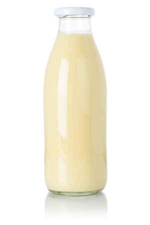 Banana smoothie fruit juice drink milkshake milk shake in a bottle isolated on a white backgroundの写真素材