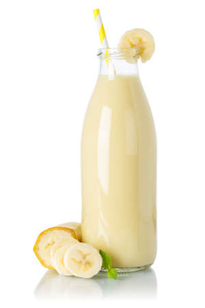 Banana smoothie fruit juice drink straw milkshake milk shake in a bottle isolated on a white backgroundの写真素材