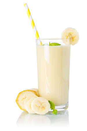 Banana smoothie fruit juice drink straw milkshake milk shake in a glass isolated on a white backgroundの写真素材