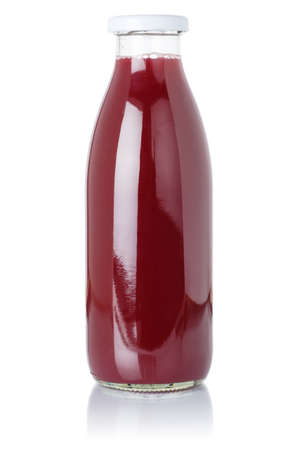 Berry smoothie fruit juice drink wild berries in a bottle isolated on a white backgroundの写真素材
