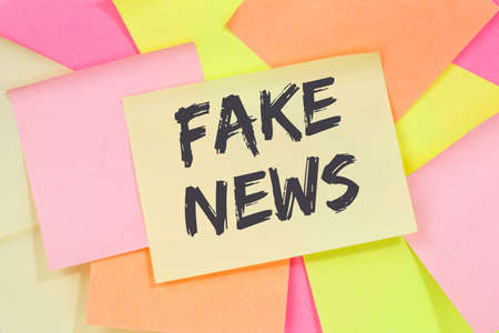 Fake news truth lie media internet online business concept note paper notepaperの写真素材