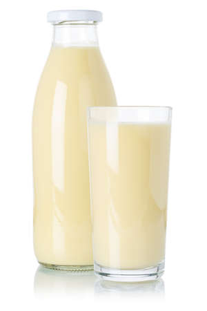 Fresh banana smoothie fruit juice drink milkshake milk shake in a bottle and glass isolated on a white backgroundの写真素材