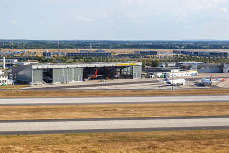 Berlin, Germany - August 19, 2020: Lufthansa Technik hangar airplanes aircraft Berlin Brandenburg BER airport aerial view photo in Germany.のeditorial素材