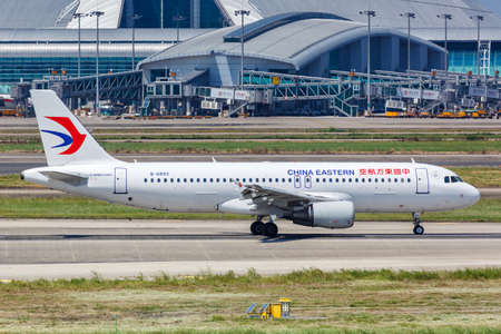 Guangzhou, China - September 24, 2019: China Eastern Airlines Airbus A320 airplane at Guangzhou Baiyun Airport in China. Airbus is a European aircraft manufacturer based in Toulouse, France.のeditorial素材