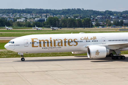 Zurich, Switzerland - July 22, 2020: Emirates Boeing 777-300ER airplane at Zurich Airport in Switzerland. Boeing is an American aircraft manufacturer headquartered in Chicago.のeditorial素材