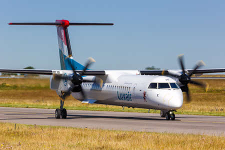 Luxembourg, Luxembourg - June 24, 2020: Luxair Bombardier DHC-8-400 airplane at Luxembourg Airport in Luxembourg.のeditorial素材