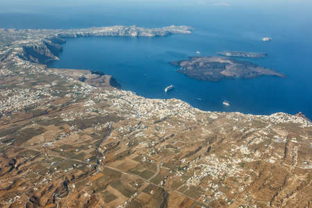 Santorini island holidays in Greece travel traveling Fira Thera town Mediterranean Sea aerial photo view Santorini shipの写真素材