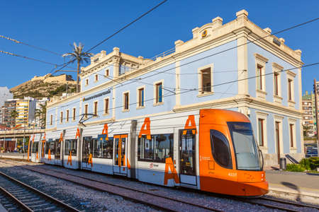 Alicante, Spain - February 17, 2022: Modern Bombardier Flexity Outlook light rail tram Alacant public transport transit transportation traffic in Alicante, Spain.のeditorial素材