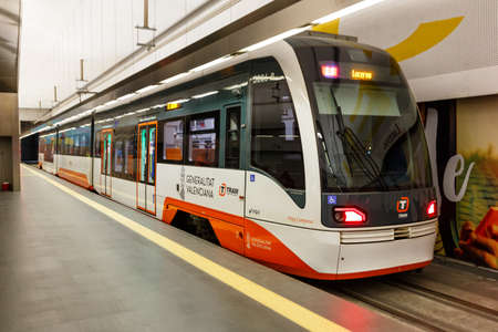 Alicante, Spain - February 16, 2022: Modern Vossloh Citylink light rail tram Alacant public transport transit transportation traffic in Alicante, Spain.のeditorial素材