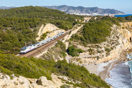 Sitges, Spain - February 20, 2022: Talgo train operated by RENFE near Sitges in Spain.のeditorial素材