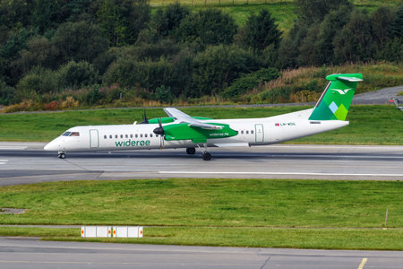Bergen, Norway - August 18, 2022: Wideroe De Havilland Canada Dash 8 Q400 airplane at Bergen airport (BGO) in Norway.のeditorial素材