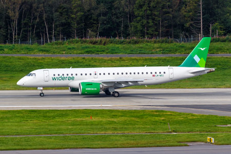 Bergen, Norway - August 18, 2022: Wideroe Embraer 190 E2 airplane at Bergen airport (BGO) in Norway.のeditorial素材