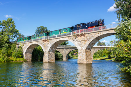 Malter, Germany - July 31, 2021: Weisseritztalbahn steam train locomotive railway near Malter, Germany.のeditorial素材