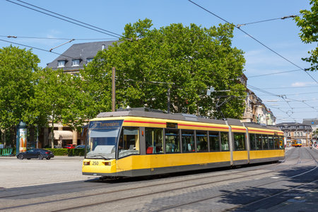 Karlsruhe, Germany - June 30, 2022: Light rail tram type GT6 public transport transit at stop main station in Karlsruhe, Germany.のeditorial素材