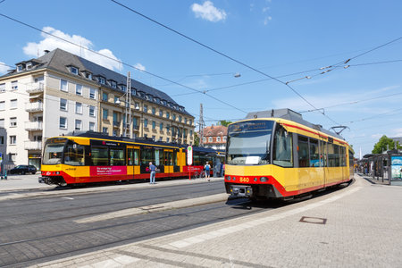 Karlsruhe, Germany - June 30, 2022: Tram-train light rail of AVG tram type GT8 public transport transit at stop main station in Karlsruhe, Germany.のeditorial素材
