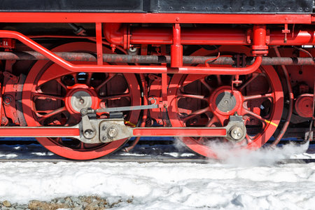 Wheels and rods on a steam train locomotive of Brockenbahn rail railway on Brocken mountain in Germanyの写真素材