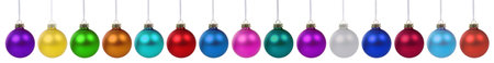 Collection of christmas decoration balls baubles colorful banner many in a row isolated on a white backgroundの写真素材