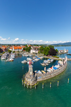 Lindau with marina town at lake Constance Bodensee portrait format yachts traveling from above top view in Germanyのeditorial素材
