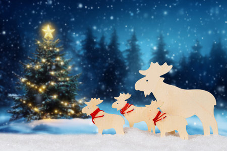 Christmas card with reindeers elks tree and copyspace copy space snowの写真素材