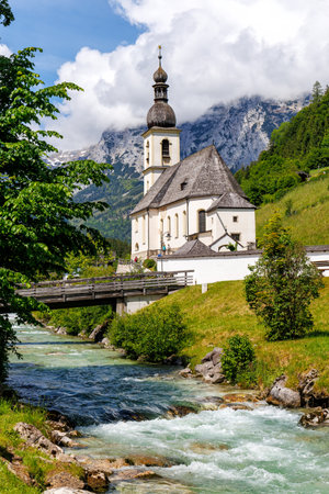 Church St. Sebastian in the Bavarian Alps portrait format in Bavaria Ramsau near Berchtesgaden, Germanyの写真素材