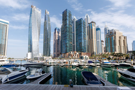 Dubai Marina skyline cityscape with yachts skyscraper real estate buildings living at water boatsの写真素材