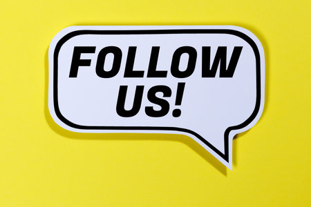 Follow us followers followers fans likes social networking media internet in speech bubble communication business concept yellowの写真素材