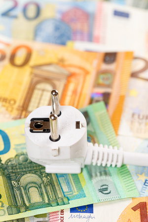 Cost of energy price of electricity symbolic photo with power cord mains cable line portrait formatの写真素材
