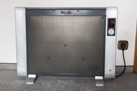 Electric heating heater with electricity symbolic photo for cost of energy priceの写真素材