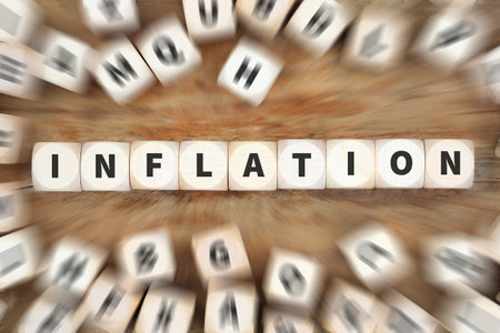Inflation symbolic photo money finance and economic crisis economy with dice business conceptの写真素材