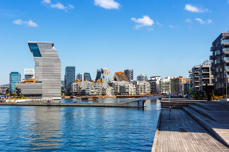 Oslo, Norway - August 15, 2022: Oslo skyline modern city architecture buildings in new BjÃ¸rvika district with Munch Museum in Oslo, Norway.