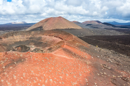 Volcanos in Timanfaya National Park on Lanzarote island travel aerial view on Canary Islands in...