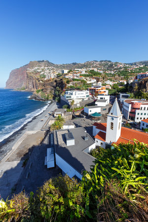 View on the town of Camara de Lobos with church travel portrait format on Madeira island in Portugalの写真素材