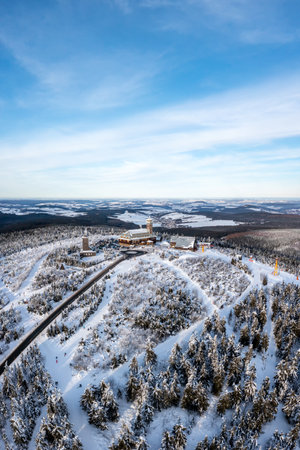 Fichtelberg highest mountain in Erzgebirge in winter snow aerial view photo portrait format in Oberwiesenthal, Germanyの写真素材