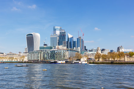 London city skyline with skyscrapers in the financial district at Thames River Englandの写真素材