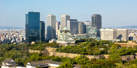 Osaka Castle from above skyline with skyscraper panorama town in Japanの写真素材