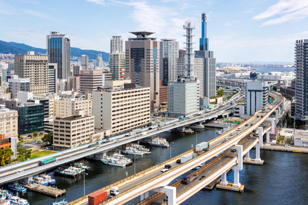 Kobe skyline from above with port and elevated road bridge in Japanの写真素材