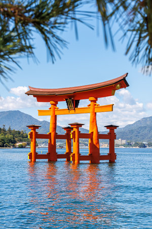 Famous red Grand Torii Gate from wood portrait format water on Miyajima island in Japanの写真素材