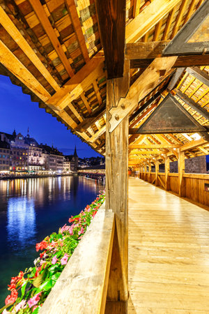 Lucerne Chapel Bridge KapellbrÃ¼cke city at Reuss river at twilight portrait format traveling in Switzerlandの写真素材