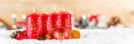 Fourth 4th Sunday in advent with burning candle Christmas time decoration deco banner with copyspace...
