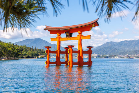 Famous red Torii Gate UNESCO World Heritage water on Miyajima island in Japanの写真素材