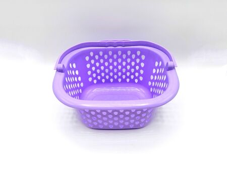 Purple color plastic basket on white background.の写真素材