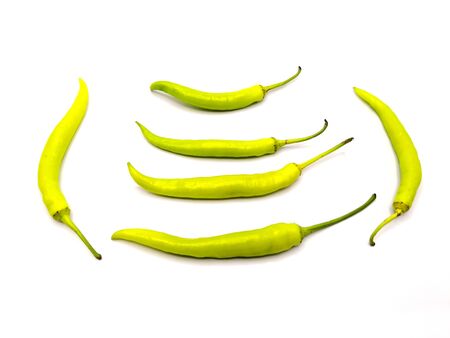 pile of Northern Thai Green Chilli or capsicum or Cayenne Pepper or bell pepper on white background.の写真素材