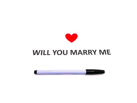 Note will you marry me sentence words written on white paper with a black pen.の写真素材