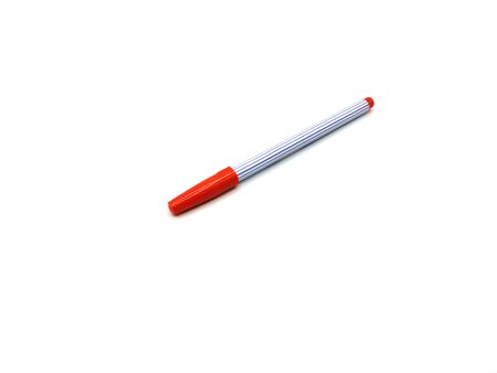 Orange color pen on white backgroundの写真素材