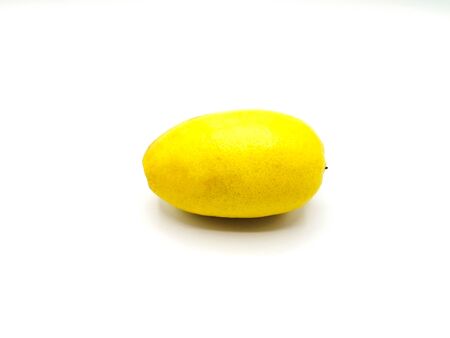 Whole fresh ripe lemon isolated on white backgroundの写真素材