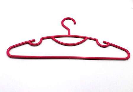 Red plastic coat hanger isolated on white backgroundの写真素材