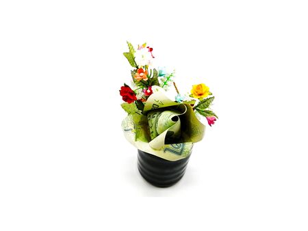 A lot of artificial beautiful flower and origami flower bouquet make by 20 baht Thai money banknote in black vase on white background.の写真素材