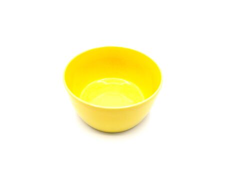 One yellow ceramic bowl on white background.の写真素材