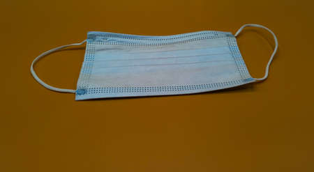 medical protective mask on light brown backgroundの写真素材